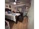 Bedroom featuring wood flooring, ceiling fan, with curtains and a dresser at 710 E Arizona Ave # A, Deland, FL 32724