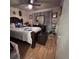 Bedroom featuring ceiling fan, hardwood floors, and neutral decor at 710 E Arizona Ave # A, Deland, FL 32724