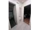 Hallway with tile flooring, closet space, and easy access to the bathroom and main bedroom at 710 E Arizona Ave # A, Deland, FL 32724