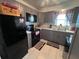 Well-lit kitchen with modern gray cabinets, sleek appliances, and ample counter space for cooking at 710 E Arizona Ave # A, Deland, FL 32724