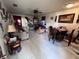 Inviting living room with tile flooring, ceiling fan, and dining area, perfect for entertaining guests at 710 E Arizona Ave # A, Deland, FL 32724