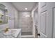 Renovated bathroom with tiled shower and modern fixtures at 713 Greenleaf Ln, Lake Wales, FL 33853