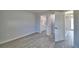 Bedroom features light gray walls and luxury vinyl plank flooring at 713 Greenleaf Ln, Lake Wales, FL 33853