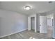 Bright bedroom featuring open closet and updated floors and lighting at 713 Greenleaf Ln, Lake Wales, FL 33853