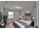 Cozy bedroom with neutral decor and luxury vinyl plank flooring at 713 Greenleaf Ln, Lake Wales, FL 33853