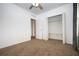 Cozy bedroom featuring neutral carpet, white walls, and a closet at 714 Franklin Ct, Haines City, FL 33844