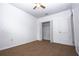 Neutral bedroom with carpet, ceiling fan, closet, and a sunlit window at 714 Franklin Ct, Haines City, FL 33844