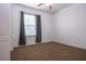 Neutral bedroom with carpet, ceiling fan, closet, and a sunlit window at 714 Franklin Ct, Haines City, FL 33844