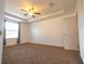 Spacious bedroom features neutral carpet, ceiling fan and ample natural light at 714 Franklin Ct, Haines City, FL 33844