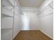 Empty walk-in closet with carpet and wire shelving at 714 Franklin Ct, Haines City, FL 33844