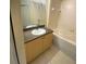 Bathroom with a neutral vanity, mirror, and a shower-tub combination at 720 Siena Palm Dr # 101, Celebration, FL 34747