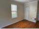 Bedroom featuring light laminate flooring, a large window, and a closet at 727 Siena Palm Dr, Celebration, FL 34747