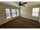 Bedroom with hardwood floors, ceiling fan, and natural light at 727 Siena Palm Dr, Celebration, FL 34747