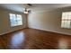 Large bedroom with hardwood floors, ceiling fan, and natural light at 727 Siena Palm Dr, Celebration, FL 34747