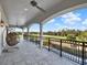 Covered balcony features golf course views and a hanging chair at 7471 Gathering Loop, Reunion, FL 34747