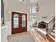 Foyer with double doors and a grand staircase that lead to the main living areas at 7471 Gathering Loop, Reunion, FL 34747