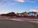 Golf course with a view of the neighborhood, showcasing the community's proximity to recreational amenities at dusk at 7471 Gathering Loop, Reunion, FL 34747