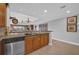 Bright kitchen featuring stainless steel dishwasher and marble countertops at 7652 Whisper Way # 401, Reunion, FL 34747