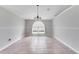 Dining room featuring tile flooring and an arched window for natural light at 856 Jarnac Dr, Kissimmee, FL 34759