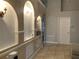 View of the entryway featuring arched wall niches with decorative lighting and tiled flooring at 856 Jarnac Dr, Kissimmee, FL 34759