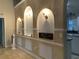 Entryway showcasing stylish wall niches with lighting and decorative accents at 856 Jarnac Dr, Kissimmee, FL 34759