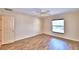 This bright bedroom has wood-look floors, and neutral colors at 105 Shaddock Dr, Auburndale, FL 33823