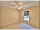 Bedroom featuring neutral walls, carpeted floor, ceiling fan and a window providing natural light at 105 Shaddock Dr, Auburndale, FL 33823