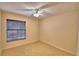 Bedroom featuring natural light from a window and a ceiling fan at 105 Shaddock Dr, Auburndale, FL 33823