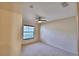 Cozy bedroom with carpet, ceiling fan, and a window with natural light at 105 Shaddock Dr, Auburndale, FL 33823