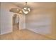 Bright dining room featuring tile floors and a decorative chandelier at 105 Shaddock Dr, Auburndale, FL 33823