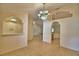 Open concept dining room featuring tiled floors and arched wall accents at 105 Shaddock Dr, Auburndale, FL 33823