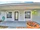 Close up of the welcoming front porch and front door at 105 Shaddock Dr, Auburndale, FL 33823