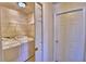 Bright laundry room includes wire shelving and a washer and dryer at 105 Shaddock Dr, Auburndale, FL 33823