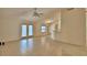 Bright living room with tile floors and doors to the backyard at 105 Shaddock Dr, Auburndale, FL 33823