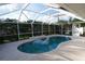 Screened-in pool with an inflatable lounge chair that provides a private and enjoyable swimming experience at 105 Shaddock Dr, Auburndale, FL 33823