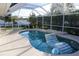 Relaxing screened pool with an inflatable lounger and beach ball, surrounded by lush greenery at 105 Shaddock Dr, Auburndale, FL 33823