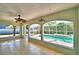 Bright pool room with tile floors offers views of the screened pool area, creating a relaxing transition to the outdoors at 105 Shaddock Dr, Auburndale, FL 33823