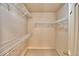 This walk-in closet boasts metal storage and carpeted floors at 105 Shaddock Dr, Auburndale, FL 33823