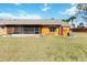 View of the backyard, showing the patio and exterior of the home at 11 Silver Falls Cir, Kissimmee, FL 34743