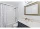 Updated bathroom with stylish vanity, framed mirror, and tub-shower combo at 11 Silver Falls Cir, Kissimmee, FL 34743