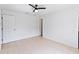 Bright and spacious bedroom featuring tile flooring, ceiling fan, and large windows at 11 Silver Falls Cir, Kissimmee, FL 34743