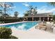 Relaxing community pool with lounge chairs and surrounding greenery at 11 Silver Falls Cir, Kissimmee, FL 34743