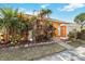 Close up of the front entrance showcasing lush landscaping and brick pathway at 11 Silver Falls Cir, Kissimmee, FL 34743