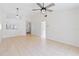 Open-concept living room featuring tile floors, vaulted ceiling, and natural lighting at 11 Silver Falls Cir, Kissimmee, FL 34743