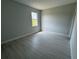 Bedroom featuring a large window that provides plenty of natural lighting at 113 Dogwood Drive Circle, Ocala, FL 34472