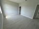 Spacious bedroom featuring wood-look flooring and neutral paint at 113 Dogwood Drive Circle, Ocala, FL 34472