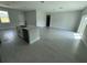 Open-concept living area with sleek flooring and abundant natural light at 113 Dogwood Drive Circle, Ocala, FL 34472