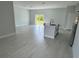 Open concept living room featuring a sliding glass door, and an island with a sink at 113 Dogwood Drive Circle, Ocala, FL 34472