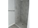 Walk-in shower featuring elegant marble tile and modern fixtures, creating a spa-like retreat at 113 Dogwood Drive Circle, Ocala, FL 34472