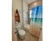 Charming bathroom with a boat-themed shelf, adding character and charm to the well-decorated space at 125 Inconnu Ct, Poinciana, FL 34759